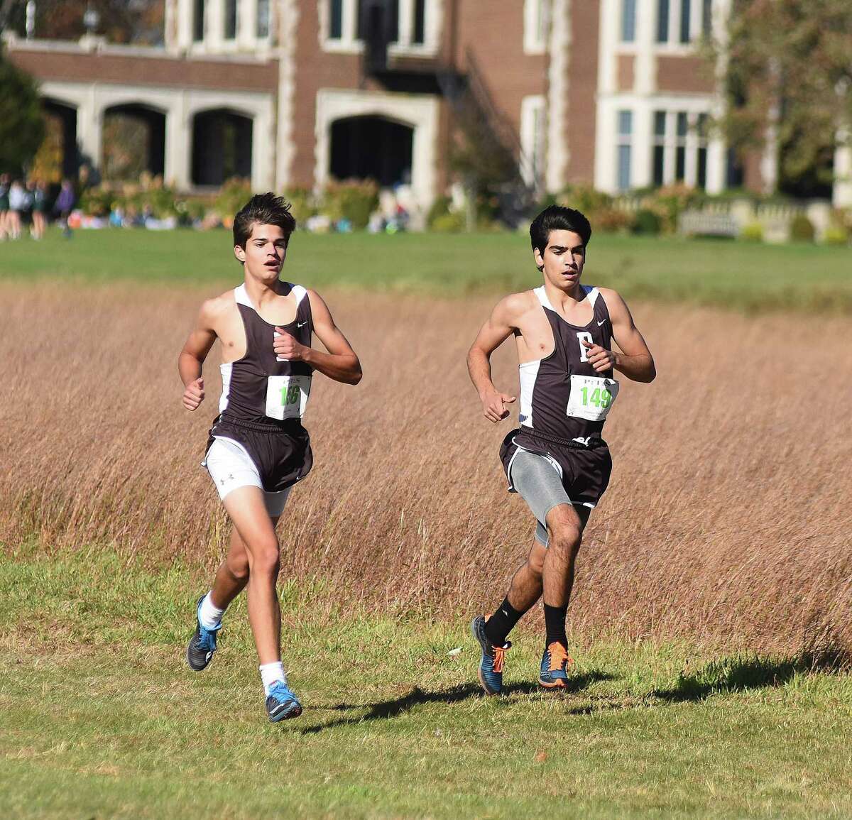 Brunswick runners Kyle Raker, left, and Andres Jasson race at Waveny Park in New Canaan on Tuesday during the FAA boys varsity cross country championship race. Jasson was among 3 Connecticut soccer players chosen to take part in NYCFC's preseason.