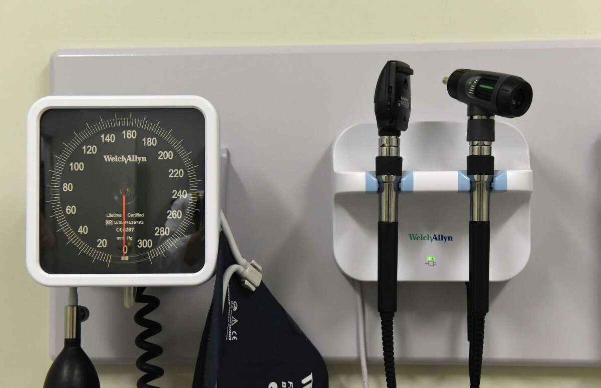 A blood pressure monitor and ear examination tools are mounted to an examination room wall in the health clinic at Mont Pleasant Middle School on Friday, June 9, 2017, in Schenectady, N.Y. (Will Waldron/Times Union)