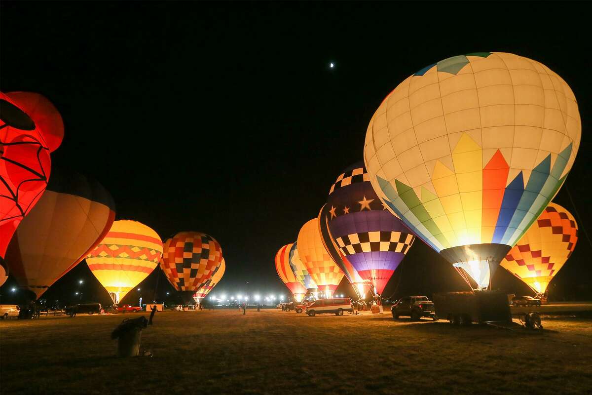 Hot air balloons are lit during the Balloon Glow during the Skylight Balloon Fest on the River City Community Church Grounds, 16765 Lookout Road in Selma, on Saturday, Oct. 28, 2017.