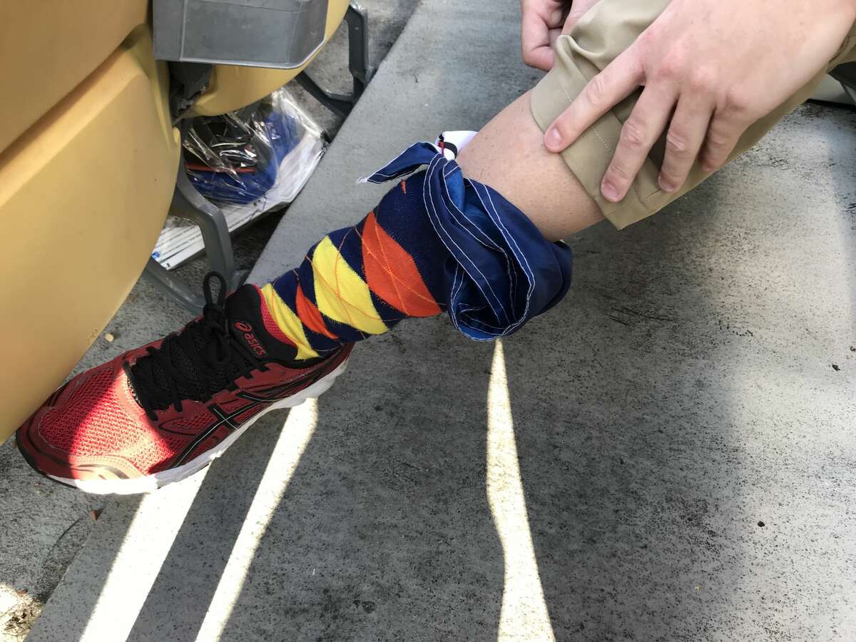 Andrew Watt stuffed a "Don't Mess With Texas" flag into his Astros socks with hopes of being able to fly it in Dodger Stadium if the Astros win the World Series.