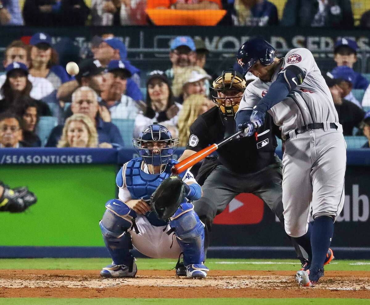 Houston Astros center fielder George Springer (4) hits a solo home run in the third inning of Game 6 of the World Series at Dodger Stadium on Tuesday, Oct. 31, 2017, in Los Angeles. ( Michael Ciaglo / Houston Chronicle )