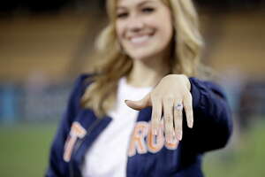 Daniella Rodriguez, former Miss Texas shows off her engagement ring after Houston Astros shortstop Carlos Correa purposed after Game 7 of baseball's World Series Wednesday, Nov. 1, 2017, in Los Angeles. The Astros won 5-1 to win the series 4-3 against the Los Angeles Dodgers. (AP Photo/Jae C. Hong)