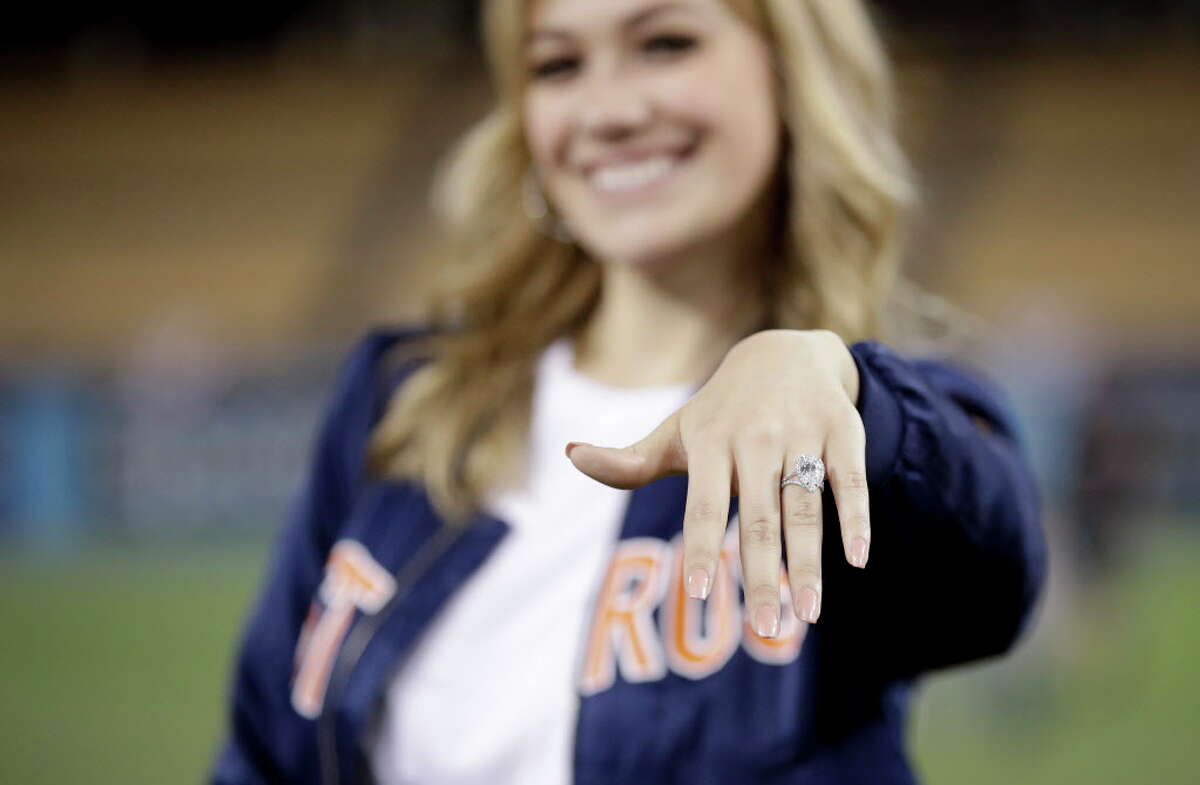 Daniella Rodriguez, former Miss Texas shows off her engagement ring after Houston Astros shortstop Carlos Correa purposed after Game 7 of baseball's World Series Wednesday, Nov. 1, 2017, in Los Angeles. The Astros won 5-1 to win the series 4-3 against the Los Angeles Dodgers. (AP Photo/Jae C. Hong)