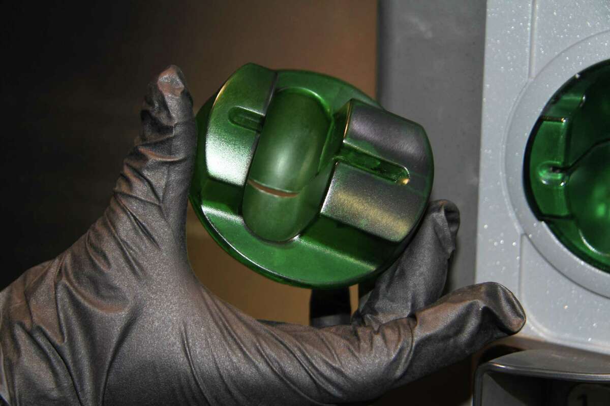 Credit card skimmers can be placed on the outside of gas pumps. This one was found by the San Antonio Police Department.