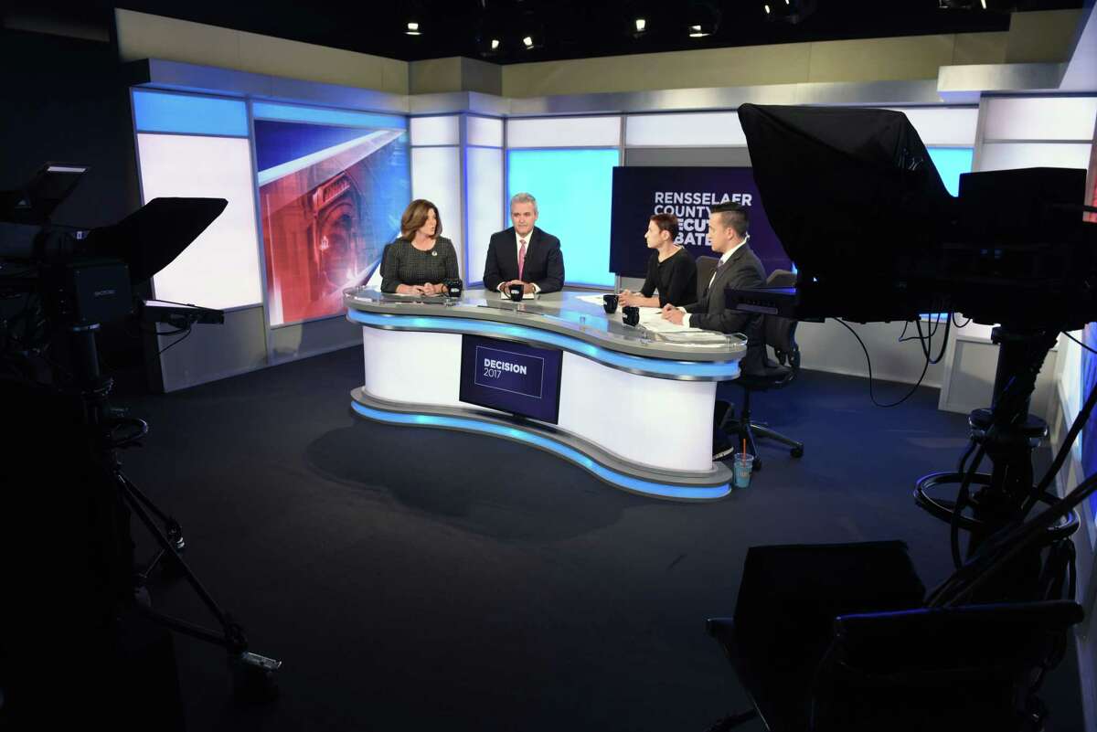 Candidates for Rensselaer County Executive; Democrat Andrea Smyth, left, and Republican Assemblyman Steven McLaughlin, second from left, take part in a debate at Spectrum News hosted by Liz Benjamin, second from right, and Solomon Syed, right, on Thursday, Nov. 2, 2017, in Albany, N.Y. (Will Waldron/Times Union)