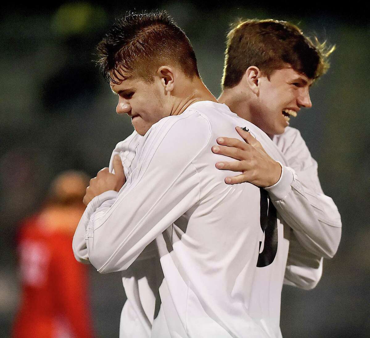 Hand juniors Lee Wildermann and Greyson McGeary celebrate following their 4-2 win over Fairfeld Prep in the SCC championship, Thursday, Nov. 2, 2017, at Ken Strong Stadium at West Haven High School.