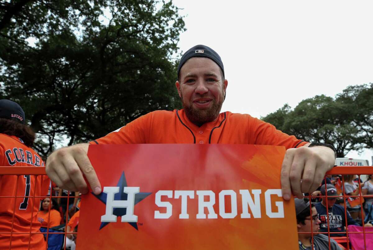 Houston Astros fan Charles Rice, 32, currently lives in Los Angeles but is originally from Houston, poses for a photograph as people set up for the World Series Championship parade Friday, Nov. 3, 2017, in Houston.