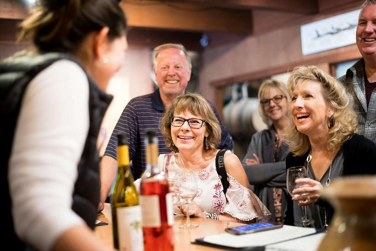Deb Schmid, left, and friends taste wines at Grgich Hills Estate on Friday, Oct. 6, 2017, in Rutherford, Calif. The vineyard's production techniques, which don't rely on egg whites or fish bladders, make all of its wines vegan.