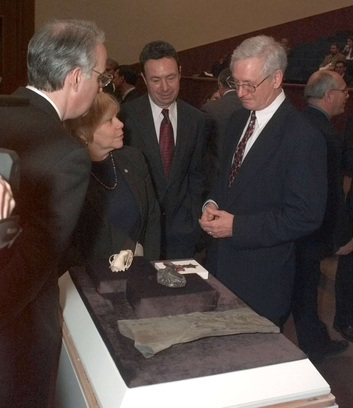 New York state Education Commissioner Richard Mills, right, shows fossils from the New York State Museum collection to legislators before a legislative hearing on the state budget Tuesday, Jan. 30, 2001 in Albany, N.Y. Assembly members are, from left: Steven Sanders, D-New York; Joan Millman, D-Brooklyn; and Ronald Canestrari, D-Albany.