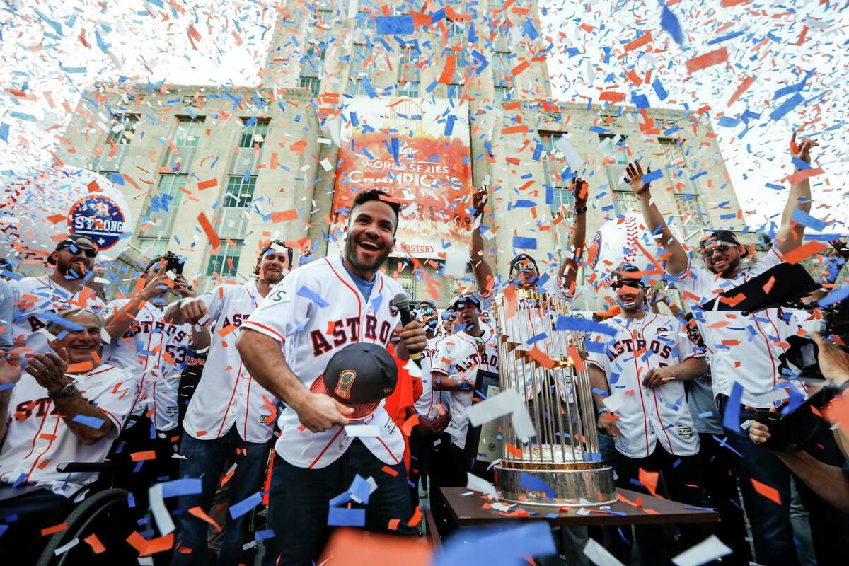 Houston Astros second baseman Jose Altuve tosses a World Series cap into the crowd during the Astros World Series championship celebration rally at City Hall on Friday, Nov. 3, 2017, in Houston.