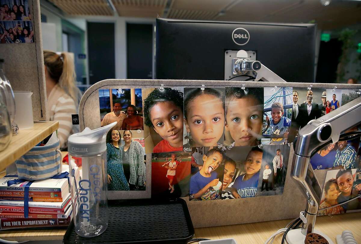 Anette Crespo is an intern in the applicant support department at Checkr in the Bounce Back 2 Work program displays pictures of her grandchildren and family at her desk on Thursday, October 26, 2017, in San Francisco, Calif.
