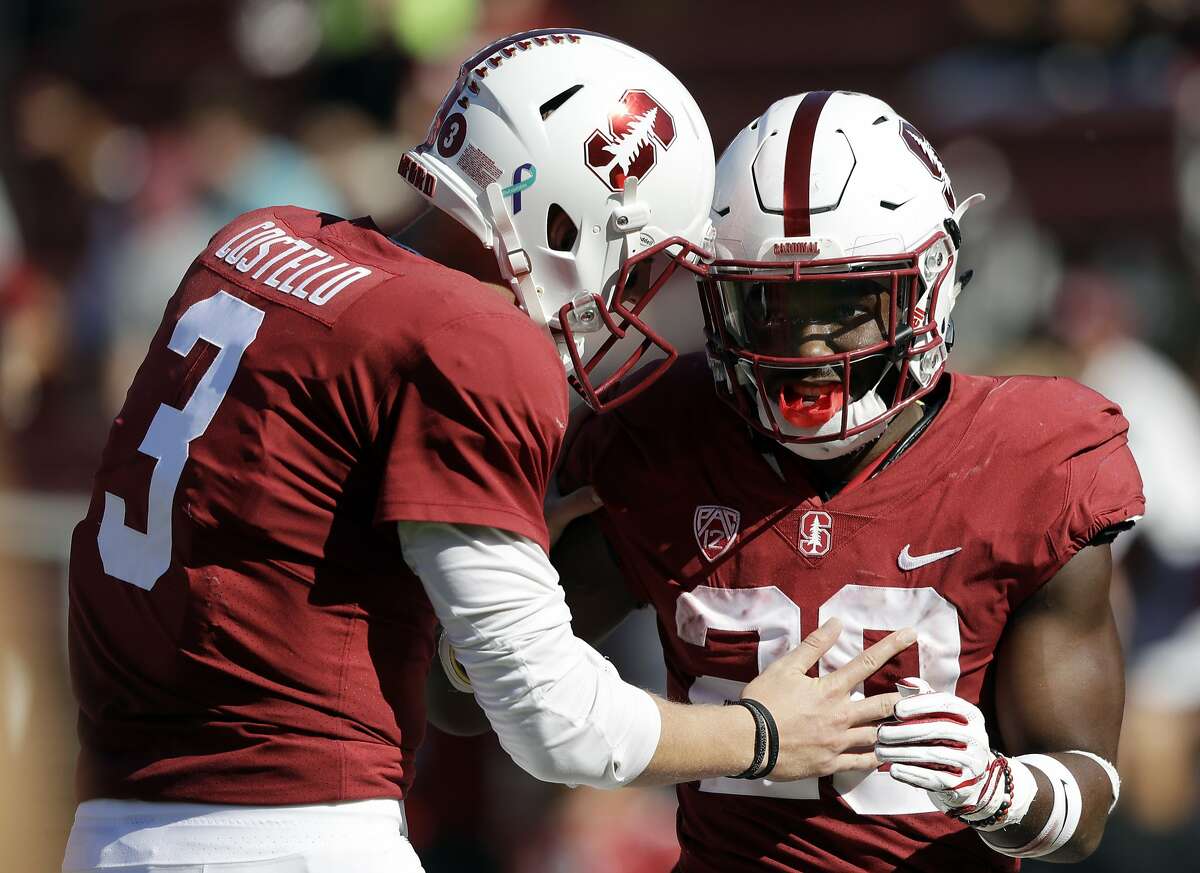 Stanford running back Bryce Love, right, celebrates his rushing touchdown with teammate K.J. Costello during the third quarter of a game against Arizona State.