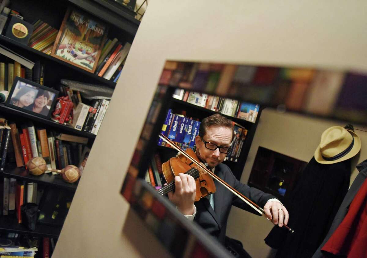 Greenwich Symphony Orchestra Principal Violist David Creswell poses with his viola in his apartment in New York. Creswell has been Principal Violist in the Greenwich Symphony Orchestra since 2003 and also performs in several Broadway musicals, substitutes with the New York Philharmonic, records studio work and teaches at the Julliard School.
