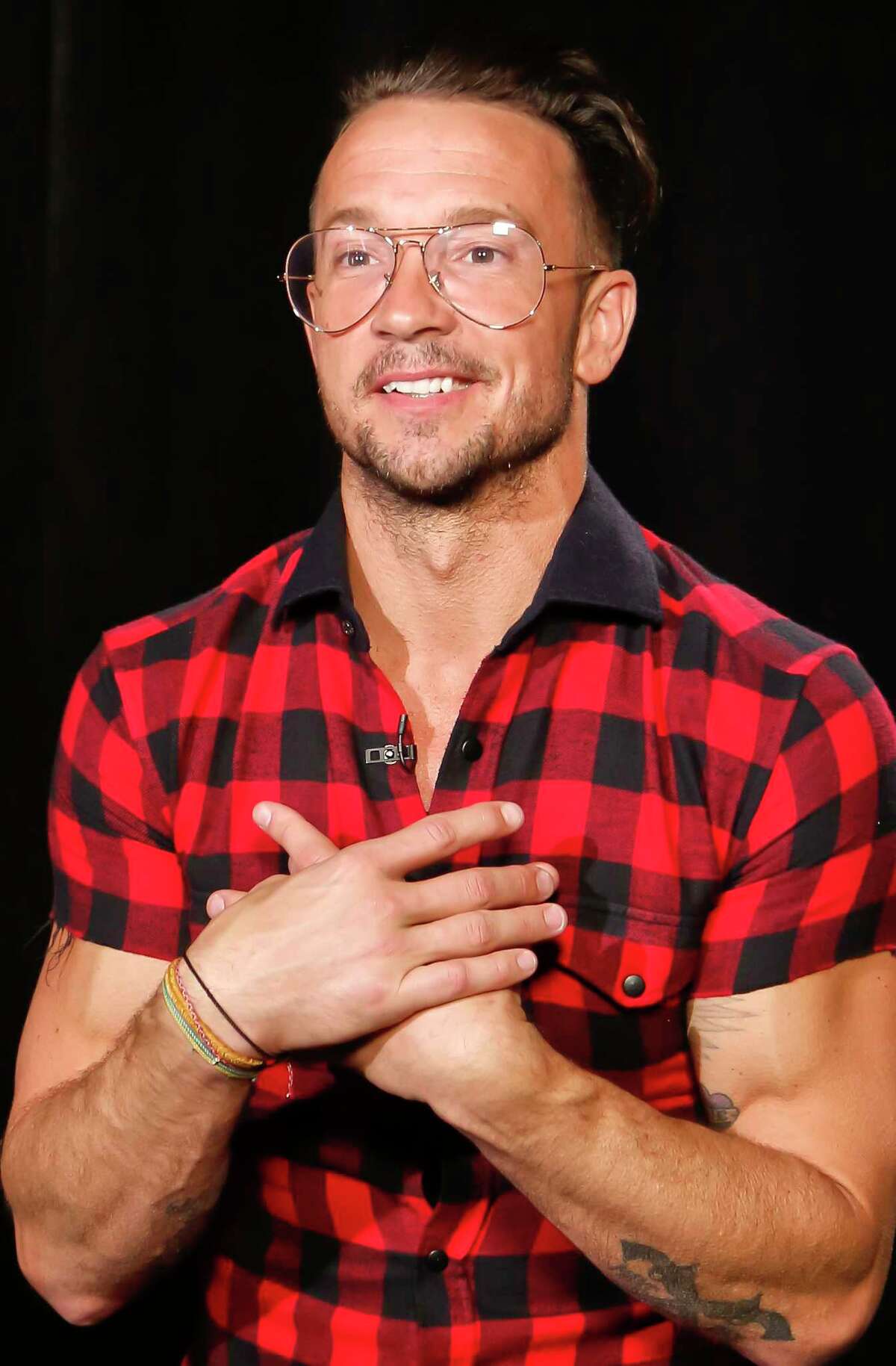In this Oct. 23, 2017 photo, Carl Lentz, a pastor who ministers to thousands at his Hillsong Church in New York, appears during an interview, in New York. His followers include NBA stars Kyrie Irving, Kevin Durant and popstar Justin Bieber. (AP Photo/Bebeto Matthews)