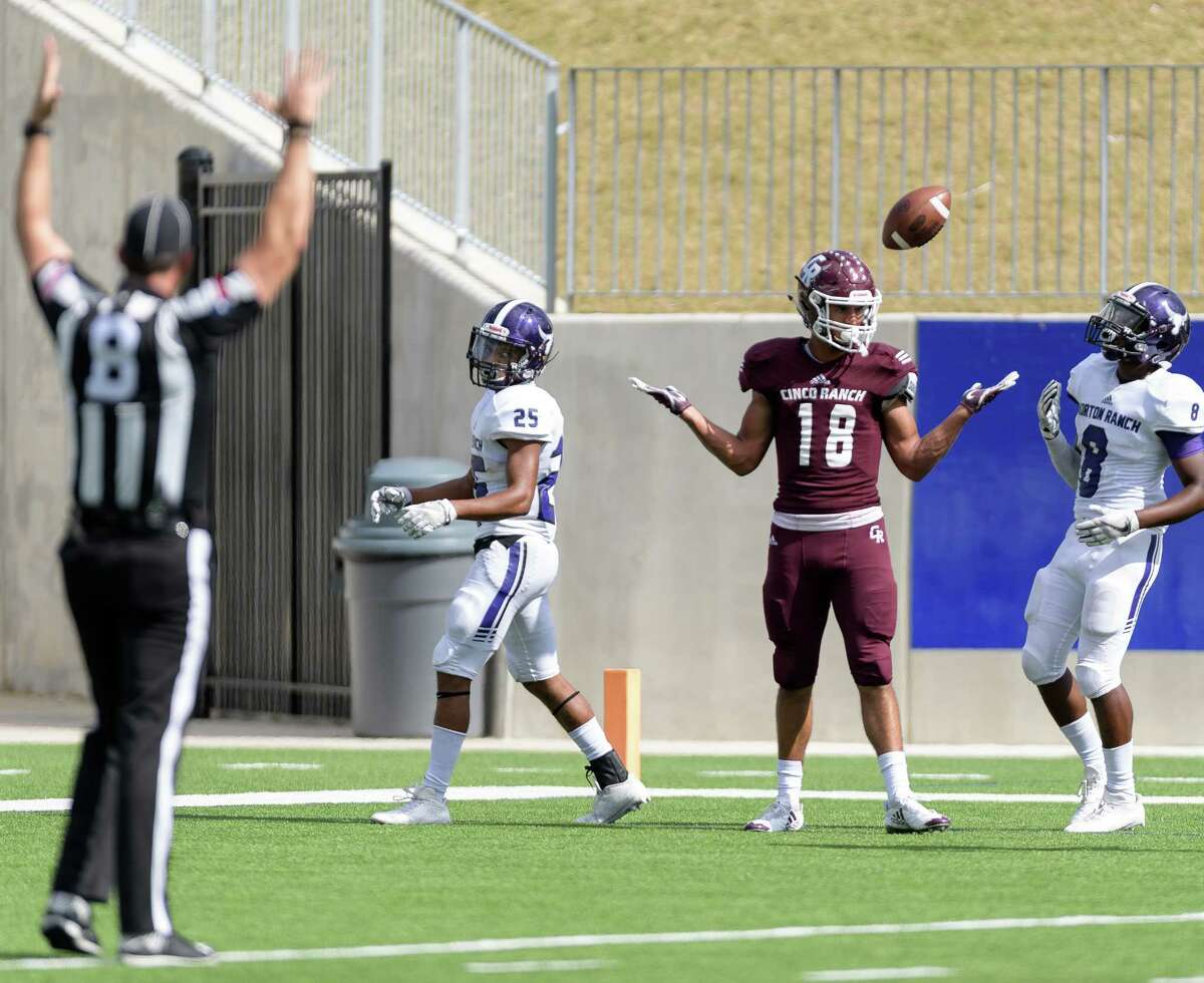 Devin Staton (18) of the Cinco Ranch Cougars scores a touchdown in the second half against the Morton Ranch Mavericks in a high school football game on Saturday, November 4, 2017 at Legacy Stadium in Katy Texas.