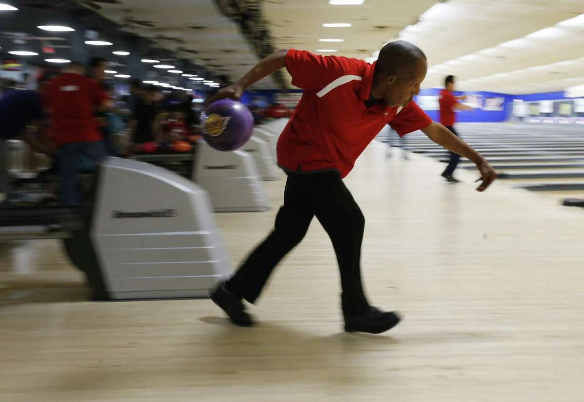Special Olympian bowler Perry William McLaurin takes a turn at the pins during a bowling tournament at Astro Superbowl on Saturday, Nov. 4, 2017. Winners from the tournament qualify for the Special Olympics USA Games in 2018. McLaurin, 29, bowled a 186 in the first game and then a 163 in the final game to win a gold medal on Saturday. McLaurin is expected to take part in the 2018 national games to be held in Seattle. (Kin Man Hui/San Antonio Express-News)