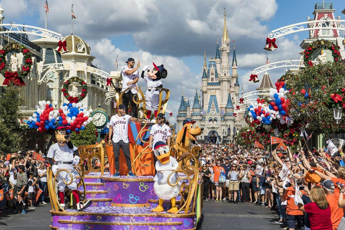 Houston Astros star players (top, then bottom l-r) World Series MVP George Springer, All-Star Carlos Correa and American League batting champion Jose Altuve lead off a World Series victory parade Saturday, Nov. 4, 2017, at Magic Kingdom Park in Lake Buena Vista, Fla. The Walt Disney World Parade saluted the team?•s first world title in its 56-year history.