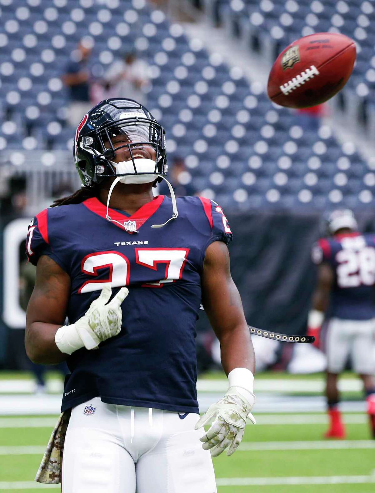 Houston Texans running back D'Onta Foreman (27) tosses a ball after catching a kick while warming up before an NFL football game at NRG Stadium on Sunday, Nov. 5, 2017, in Houston.