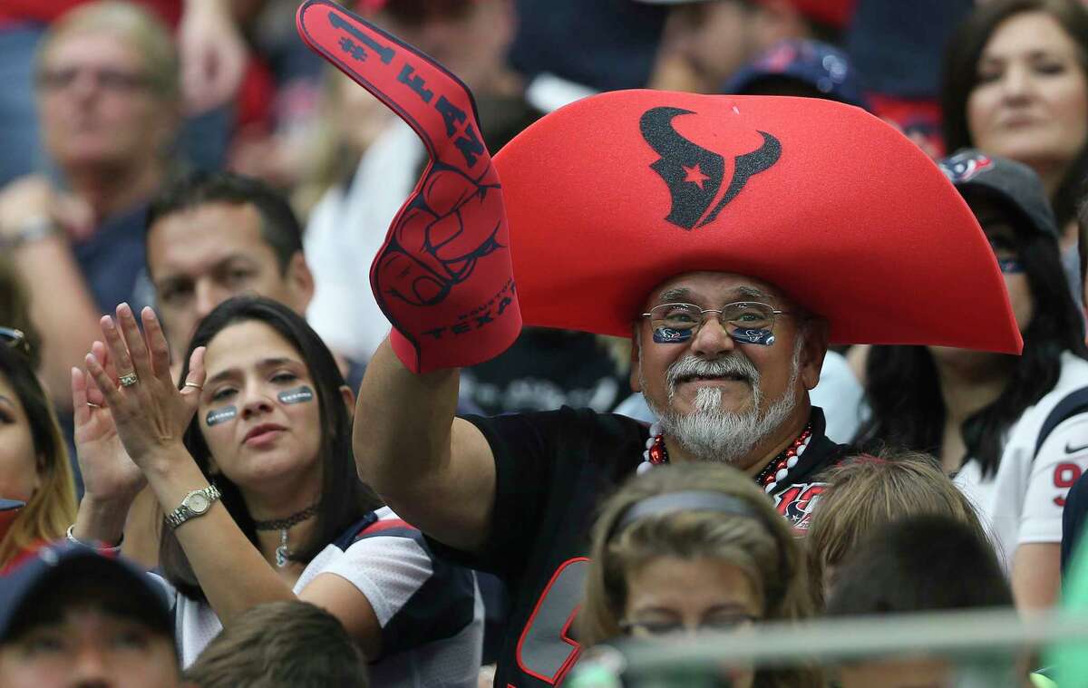 A Houston Texans fan cheers for the team during the first quarter of an NFL football game against the Indianapolis Colts at NRG Stadium on Sunday, Nov. 5, 2017, in Houston.