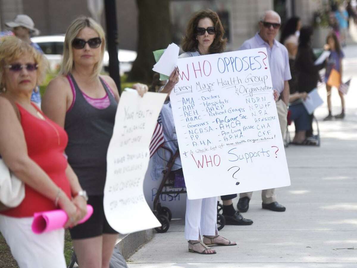 Greenwich's Celeste Wilson, an advocate of the anti-Trump group Indivisible Greenwich, at a protest in in June. The group is running female candidates for the RTM and criticized a local blogger for his woman-hating comments.
