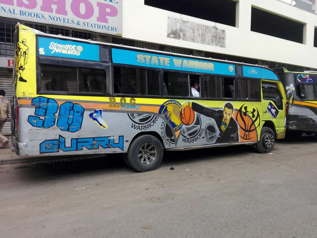 A matatu public transit bus in Nairobi, Kenya decorated with Stephen Curry and Warriors designs.