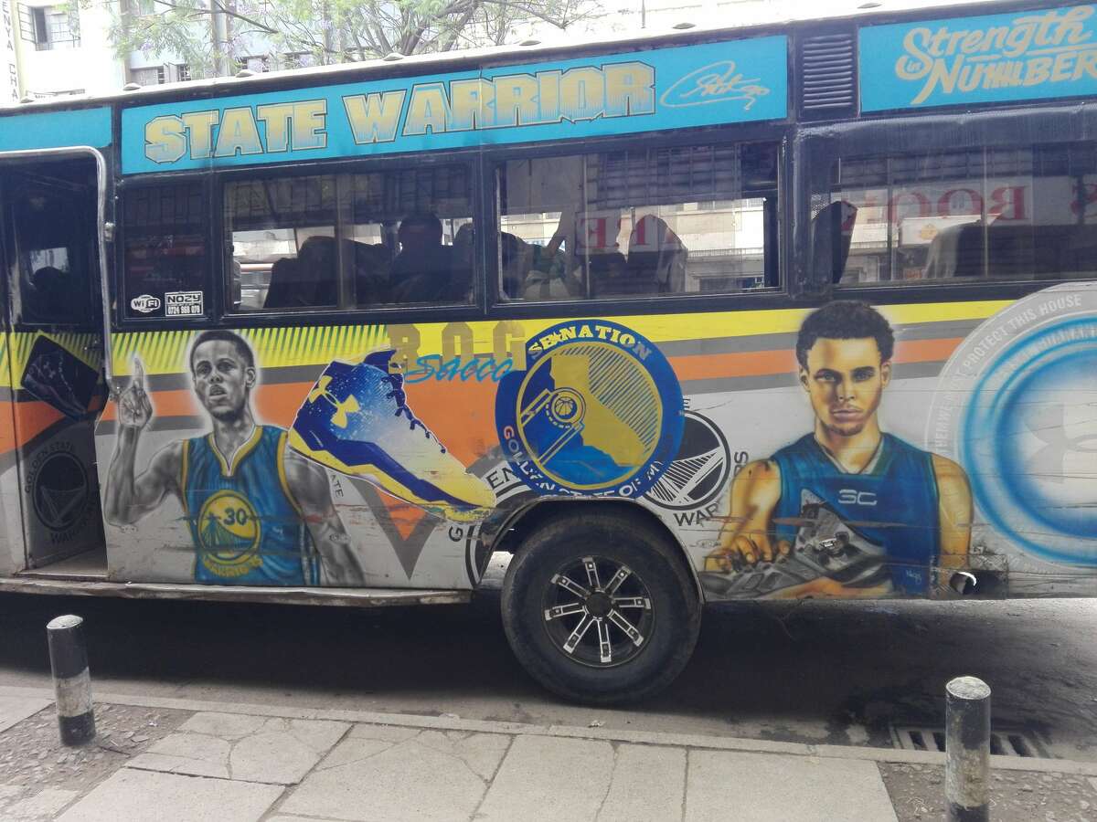 A matatu public transit bus in Nairobi, Kenya decorated with Stephen Curry and Warriors designs.