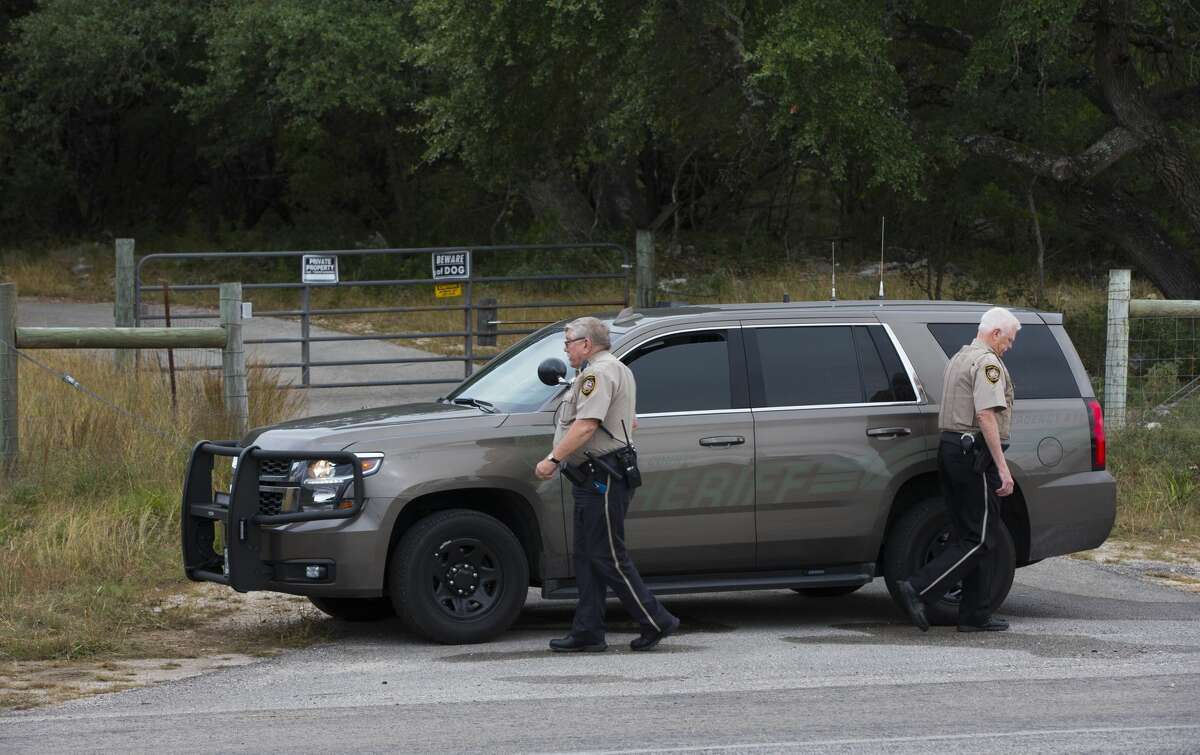Comal County Sheriff deputies at the front gate to the home and property of Devin P. Kelley November 6, 2017 near New Braunfels, Texas. Kelley was the alleged gunman that killed at least 26 people and as many as 20 injured in mass shooting at First Baptist Church in Sutherland Springs, Texas.