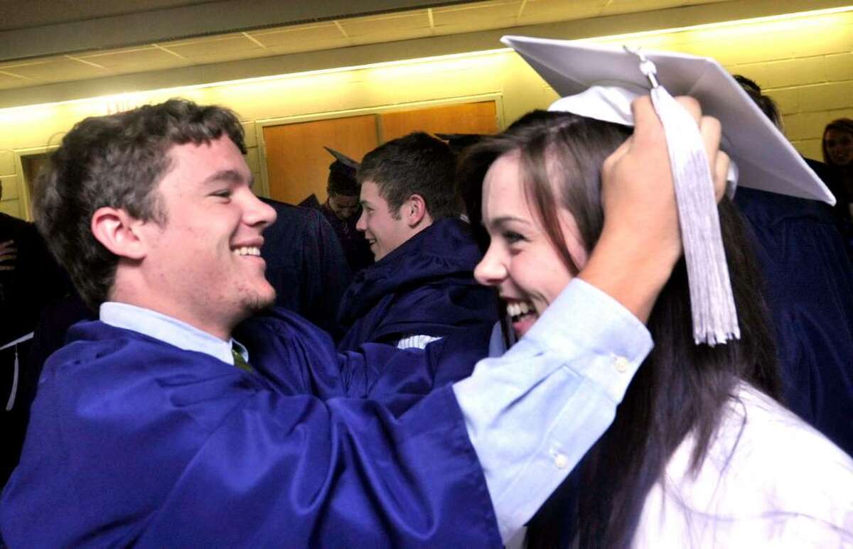 Brian Bacan adjusts Megan Heffernan's cap at New Fairfield High School commencement exercises at the William O'Neill Convocation Center in Danbury, on Saturday, June 26, 2010.