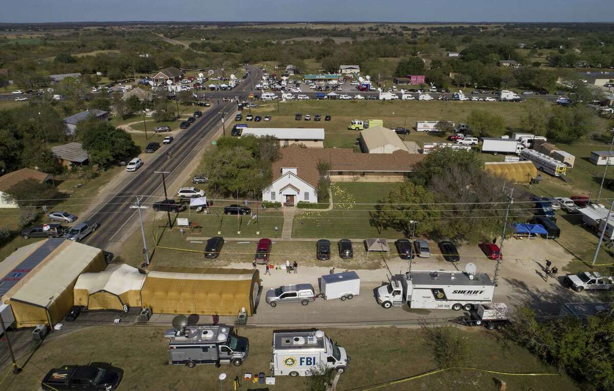 Investigators work at the First Baptist Church in Sutherland Springs, Texas, Monday, Nov. 6, 2017, the day after over 20 people died in a mass shooting Sunday. (Jay Janner/Austin American-Statesman via AP)