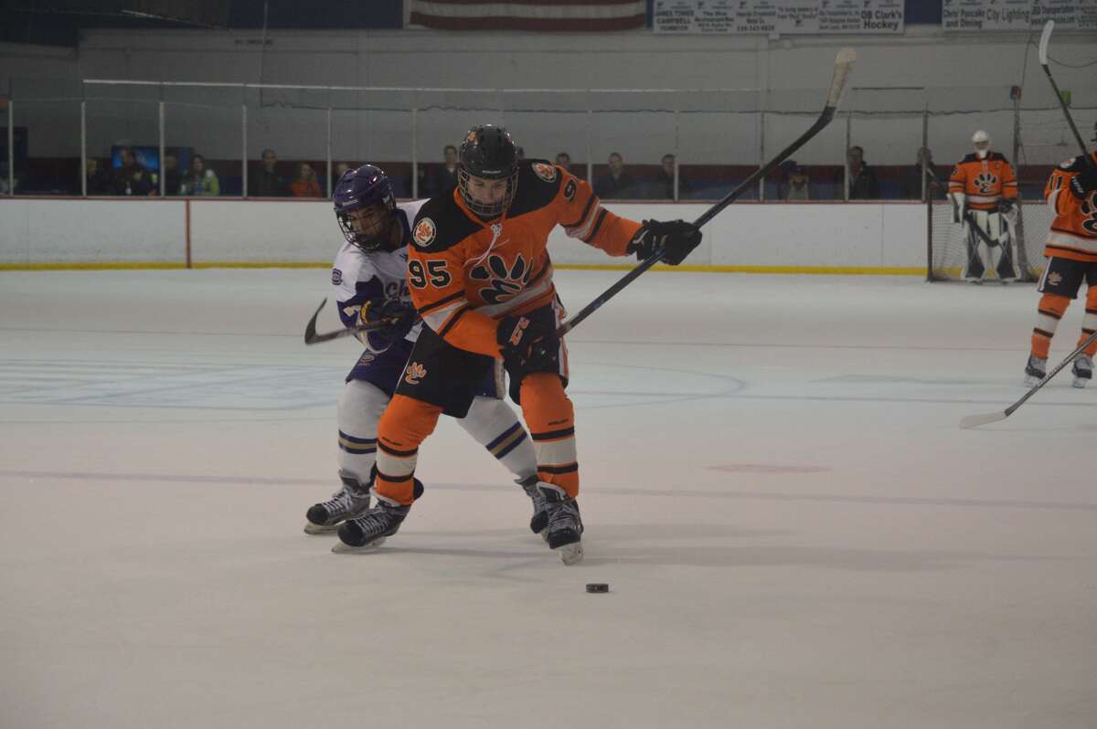 Edwardsville's William Schuster tries to work his way past a CBC defender during the second period of Monday's game at the Affton Ice Arena.