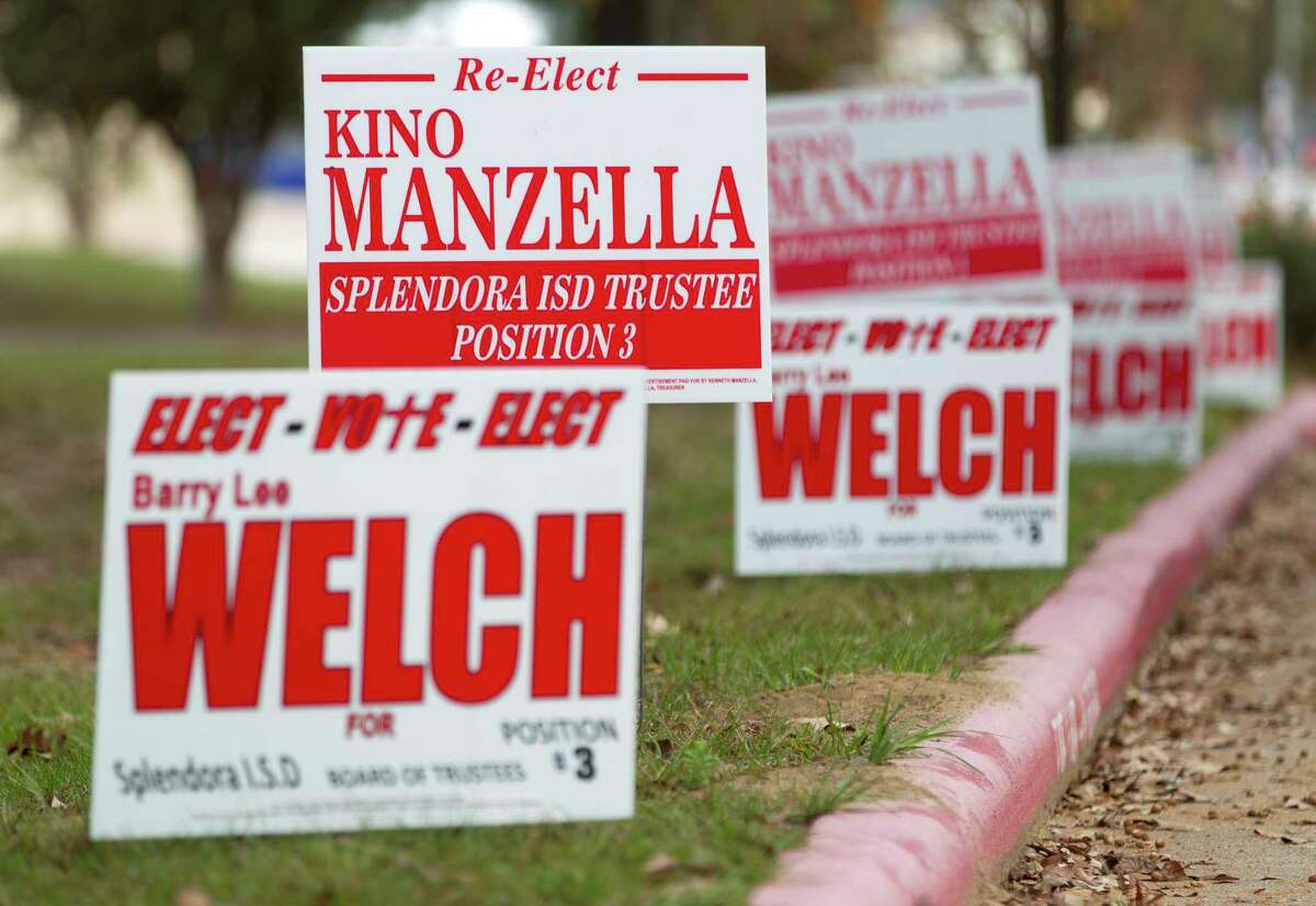 Campaign signs for Splendora ISD School Board candidates Kino Manzella and Barry Welch are seen outside a polling location on Election Day, Tuesday, Nov. 7, 2017, in Splendora.