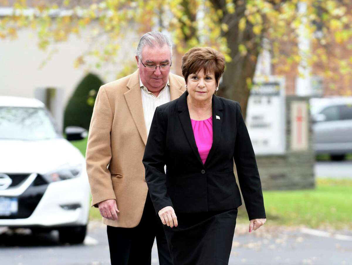 Colonie Town Supervisor Paula Mahan is accompanied by her husband Joseph as they enter the Latham Community Baptist Church polling place on Tuesday, Nov. 7, 2017, in Colonie, N.Y. (Will Waldron/Times Union)