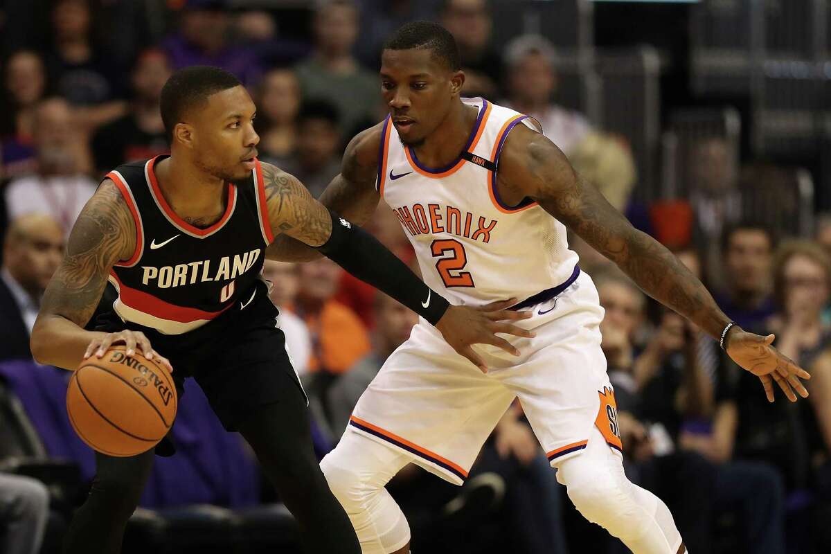 PHOENIX, AZ - OCTOBER 18: Damian Lillard #0 of the Portland Trail Blazers handles the ball against Eric Bledsoe #2 of the Phoenix Suns during the first half of the NBA game at Talking Stick Resort Arena on October 18, 2017 in Phoenix, Arizona. NOTE TO USER: User expressly acknowledges and agrees that, by downloading and or using this photograph, User is consenting to the terms and conditions of the Getty Images License Agreement.