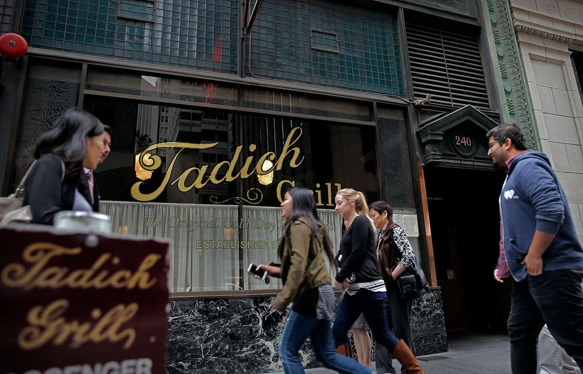 People passing by the Tadich Grill on California St. in San Francisco, Calif. on Tues. October 27, 2015.