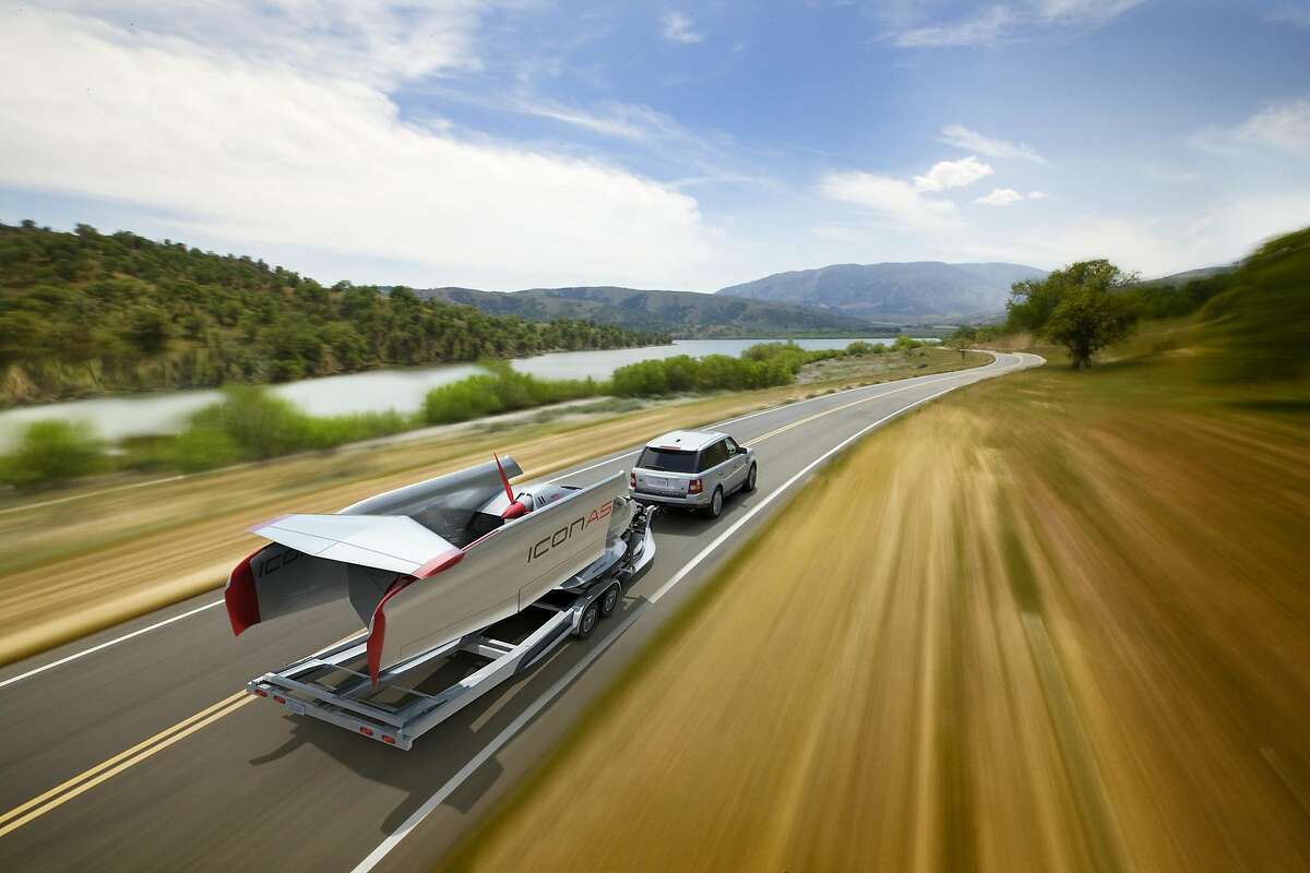 Two Stanford engineers have developed a new plane, the ICON A5, that not only flies but can folded up and be towed by a car. This artist rendering shows the plane in the folded up and being towed by a car. ICON Aircraft / Courtesy to The Chronicle