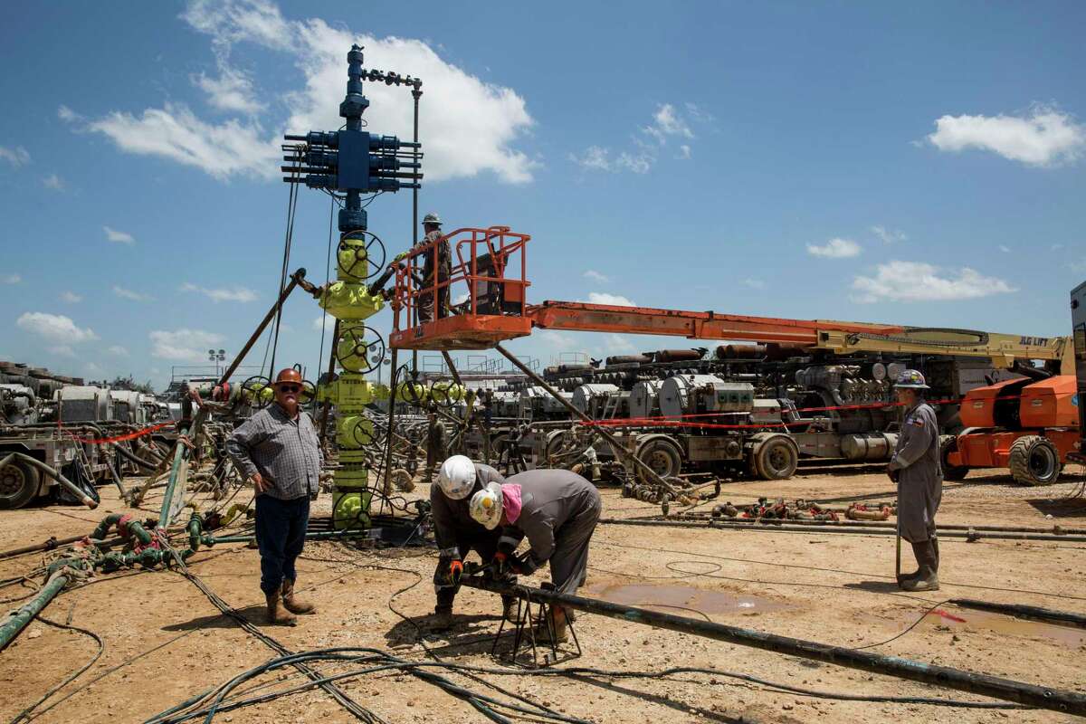People work on the Abraxas Petroleum Corporation frac spread in Atascosa County Texas on August 23, 2016.