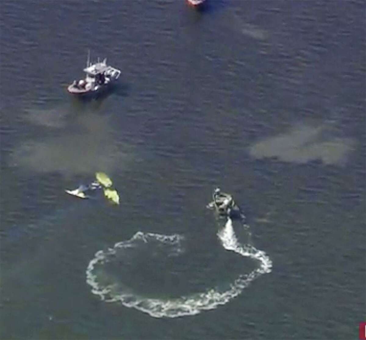 In this image provided by WTVT-TV FOX 13 Tampa Bay, authorities investigate a small plane crash in the Gulf of Mexico, near Holiday, Fla. on Tuesday, Nov. 7, 2017. Authorities have confirmed that former Major League Baseball pitcher Roy Halladay died in a small plane crash in the Gulf of Mexico off the coast of Florida. (WTVT-TV FOX 13 Tampa Bay, via AP)