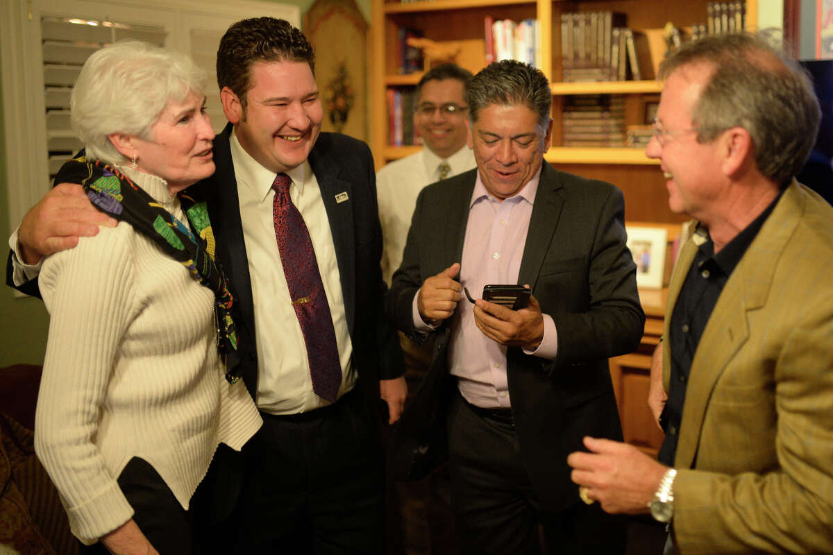 From left, city councilwoman Sharla Hotchkiss, city councilman J. Ross Lacy, city mayor Jerry Morales, and Midland Development Corporation president Brent Hilliard react to early voting results in favor of the proposed Road Bond Nov. 7, 2017, at an election results party. James Durbin/Reporter-Telegram