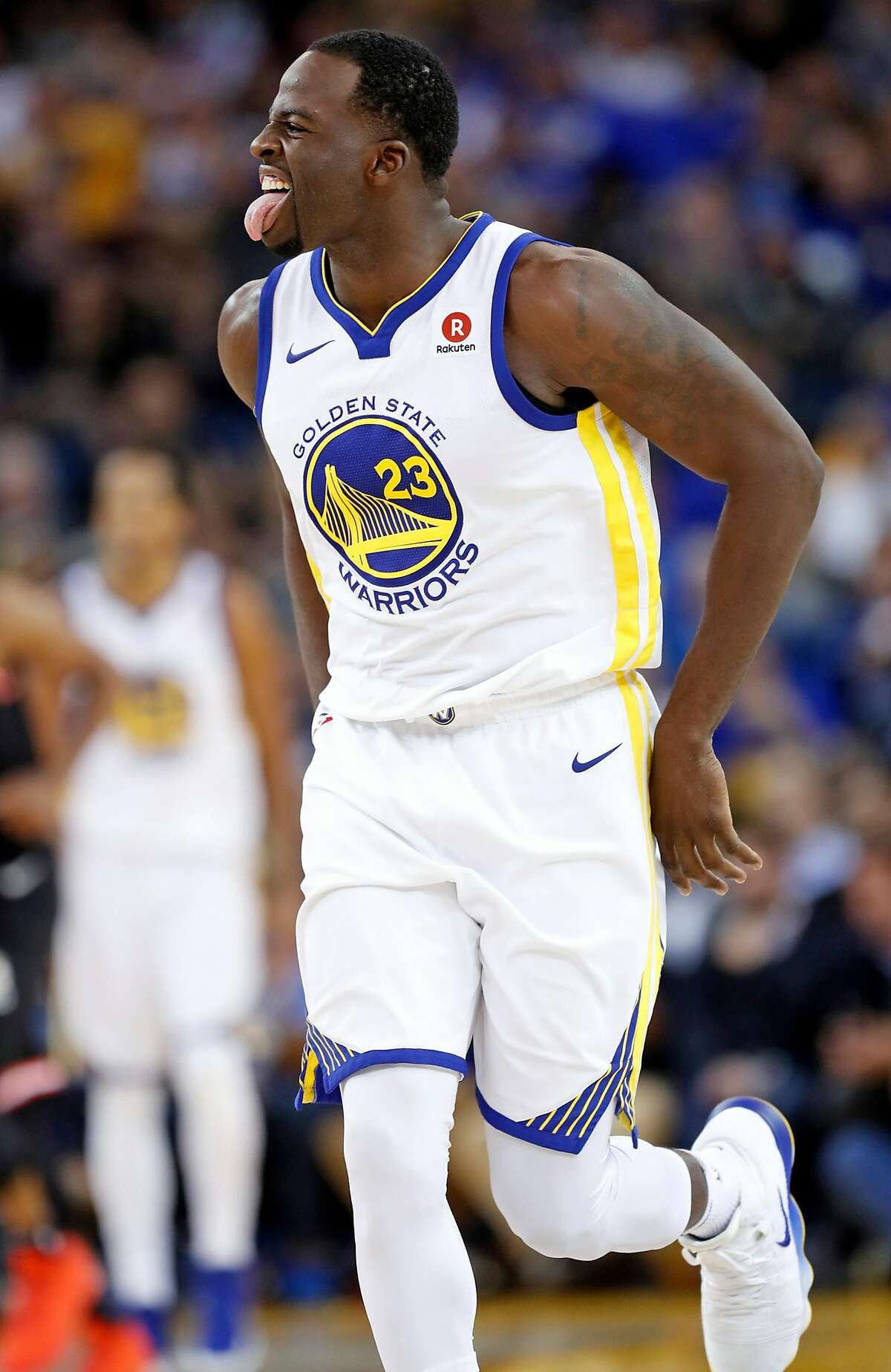 Golden State Warriors' Draymond Green reacts to making a 3-pointer in 4th quarter against Miami Heat during Warriors' 97-80 win in NBA game at Oracle Arena in Oakland, Calif., on Monday, November 6, 2017.