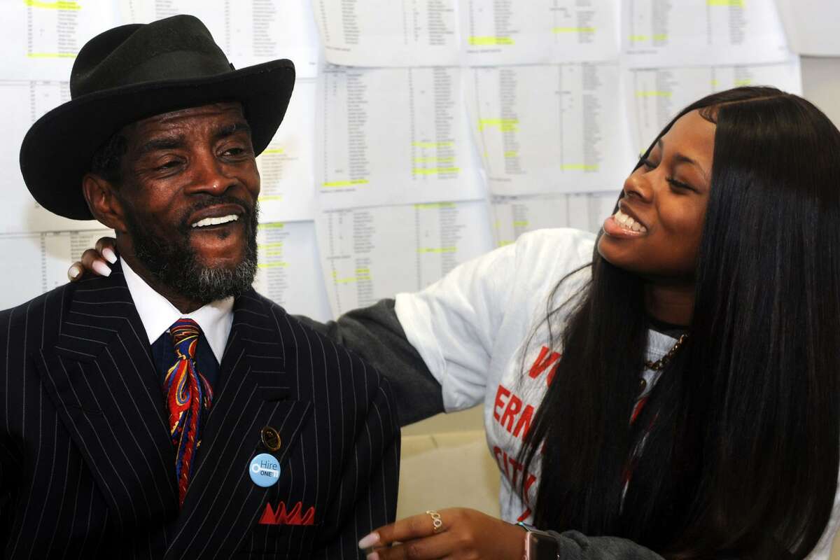 Ernest Newton, candidate in Bridgeport’s 139th City Council District, celebrates with his daughter, Kayla, as election results come in at his campaign headquarters in Bridgeport, Conn. Nov. 7, 2017. Newton secured a seat on the city council in Tuesdays elections.