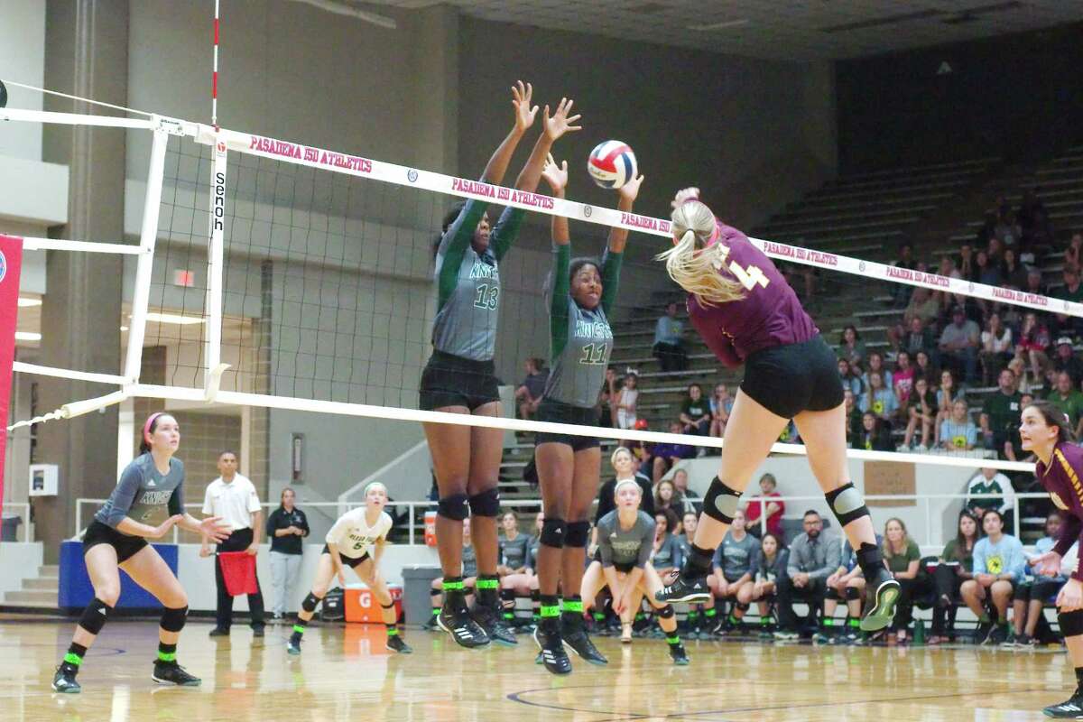 Clear Falls' Anita Parrott (13) and Clear Falls' Rachel Brown (11) go high to block a shot by Deer Park's Morgan Railey (4) Tuesday, Nov. 7 at Pasadena ISD Phillips Field House.