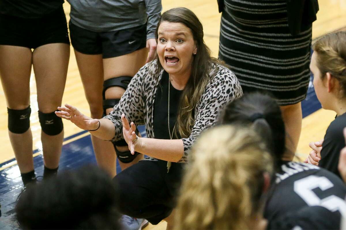 Clark head coach Melissa Miller talks to her team during a time out in their Class 6A third-round high school volleyball playoff match with Reagan at the Alamo Convocation Center on Tuesday, Nov. 7, 2017. MARVIN PFEIFFER/mpfeiffer@express-news.net