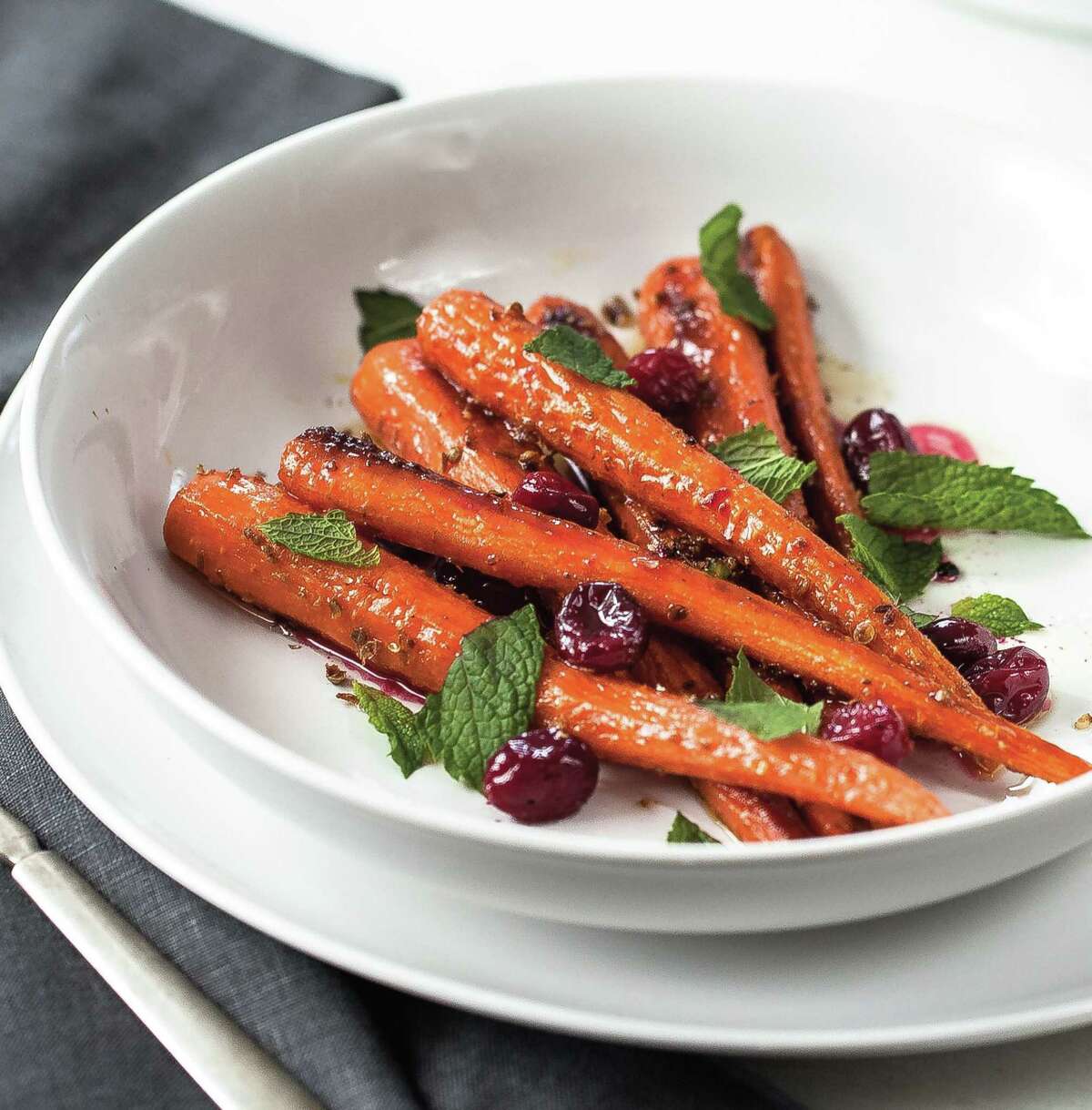 Roasted Carrots and Cranberries. Turn carrots into something special with cranberries and a few spices. The Cranberry Cookbook, by Sally Vargas, courtesy of Globe Pequot