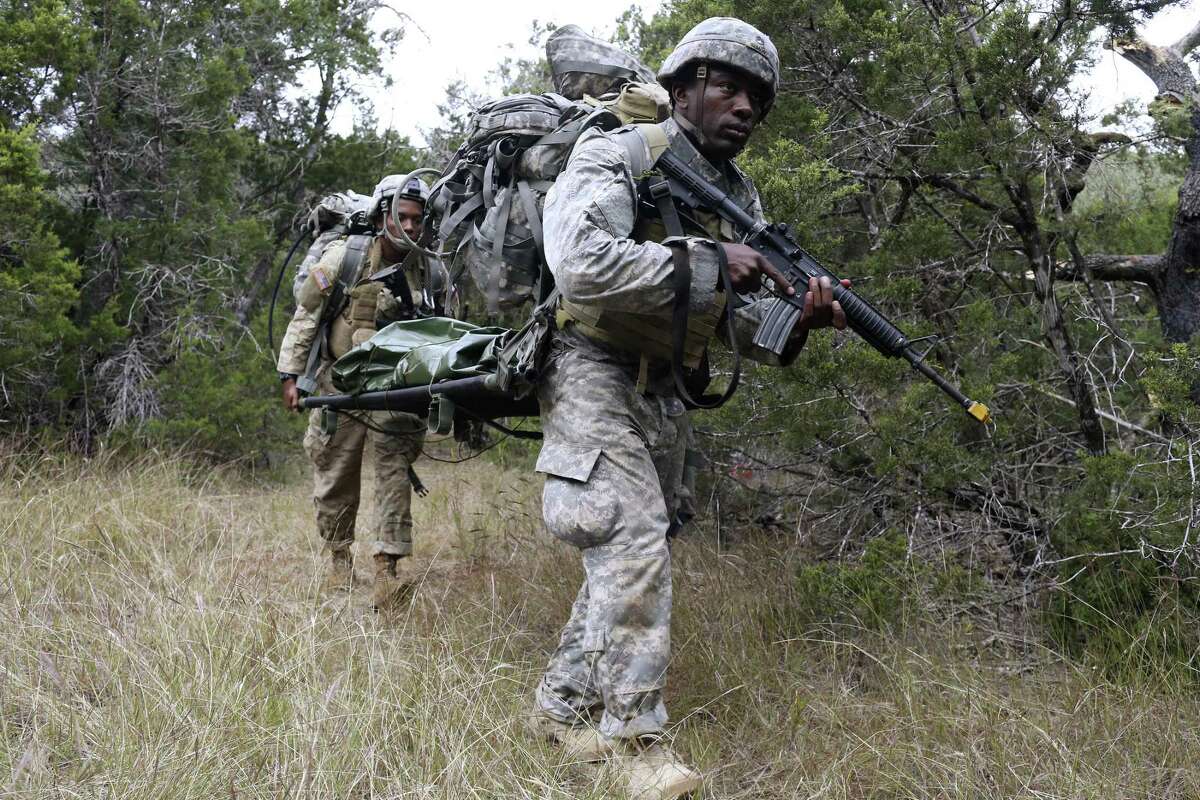 Staff Sgt. Lionel Semon, right, and Sgt. Rolando Fender carry a dummy during a medical evacuation exercise in the Army Best Medic Competition at Camp Bullis, Tuesday, Oct. 31, 2017. Twenty-nine two-soldier teams from throughout the country started the seven-day competition on Oct. 27. They are with the Airborne and Ranger Training Brigade.