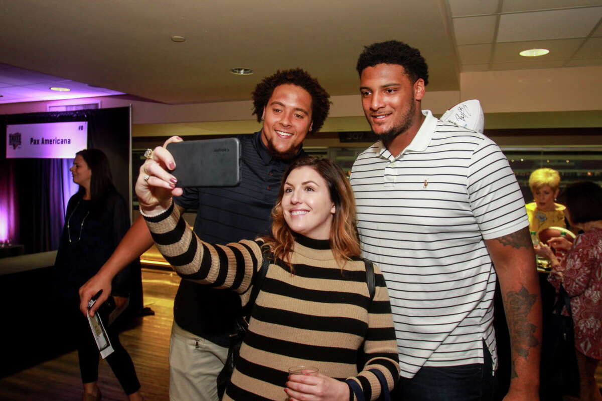 Whitney Lambert taking a selfie with Houston Texans Kendall Lamm, left, and Julien Davenport at the Taste of the Texans.