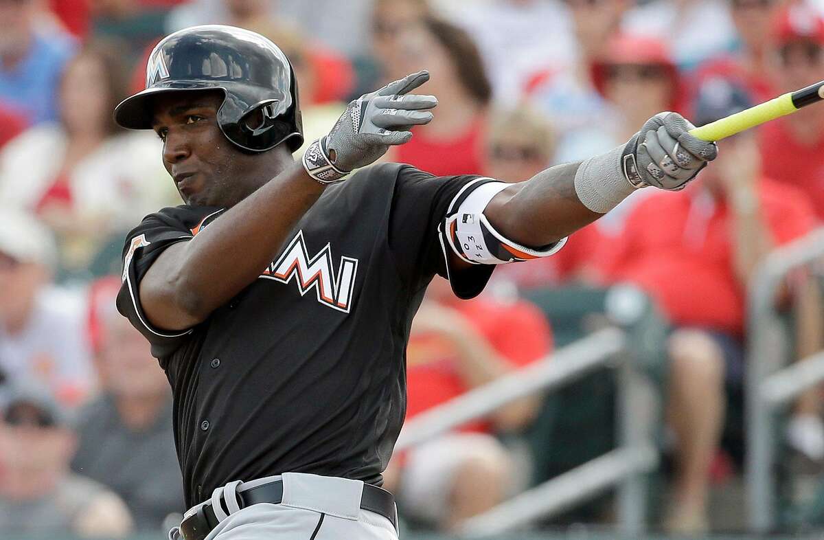Miami Marlins' Marcell Ozuna bats during the third inning of an exhibition spring training baseball game against the St. Louis Cardinals Thursday, March 3, 2016, in Jupiter, Fla. (AP Photo/Jeff Roberson)
