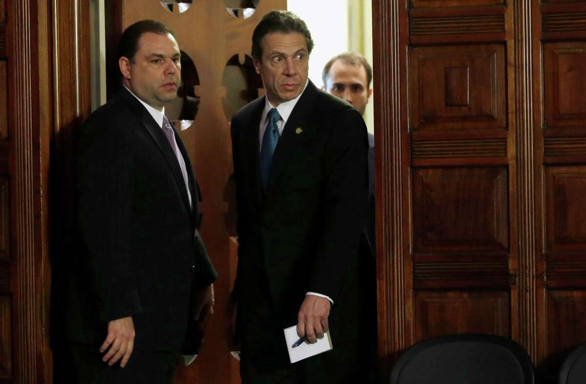 Joseph Percoco, executive deputy secretary, left, and Gov. Andrew Cuomo, right, in 2013. Percoco is facing a corruption trial in federal court in early 2018. (AP Photo/Mike Groll)