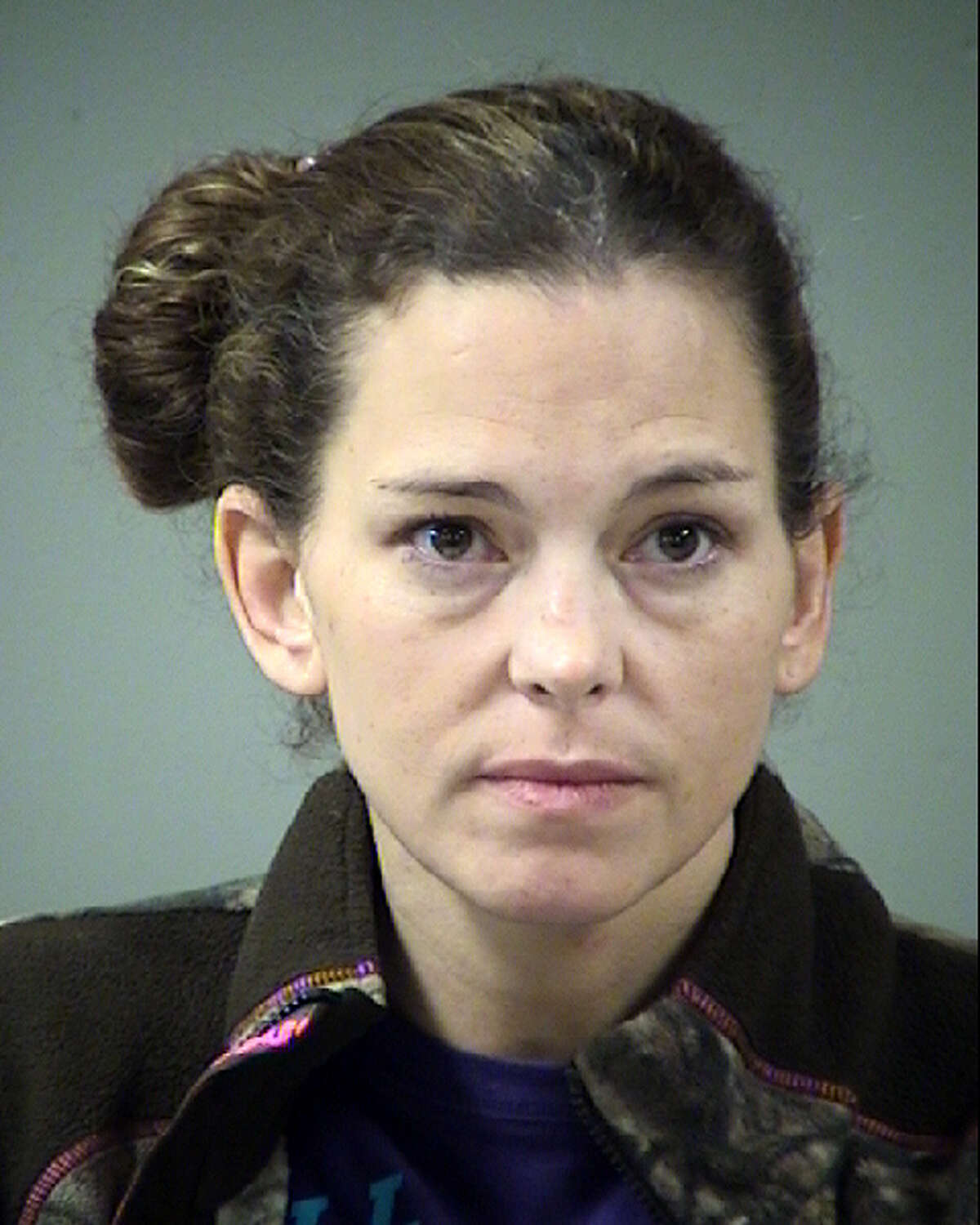 Melissa Feist-McCuistion, 39, now faces a charge of public lewdness. She was booked into the Bexar County Jail on a $1,600 bond.