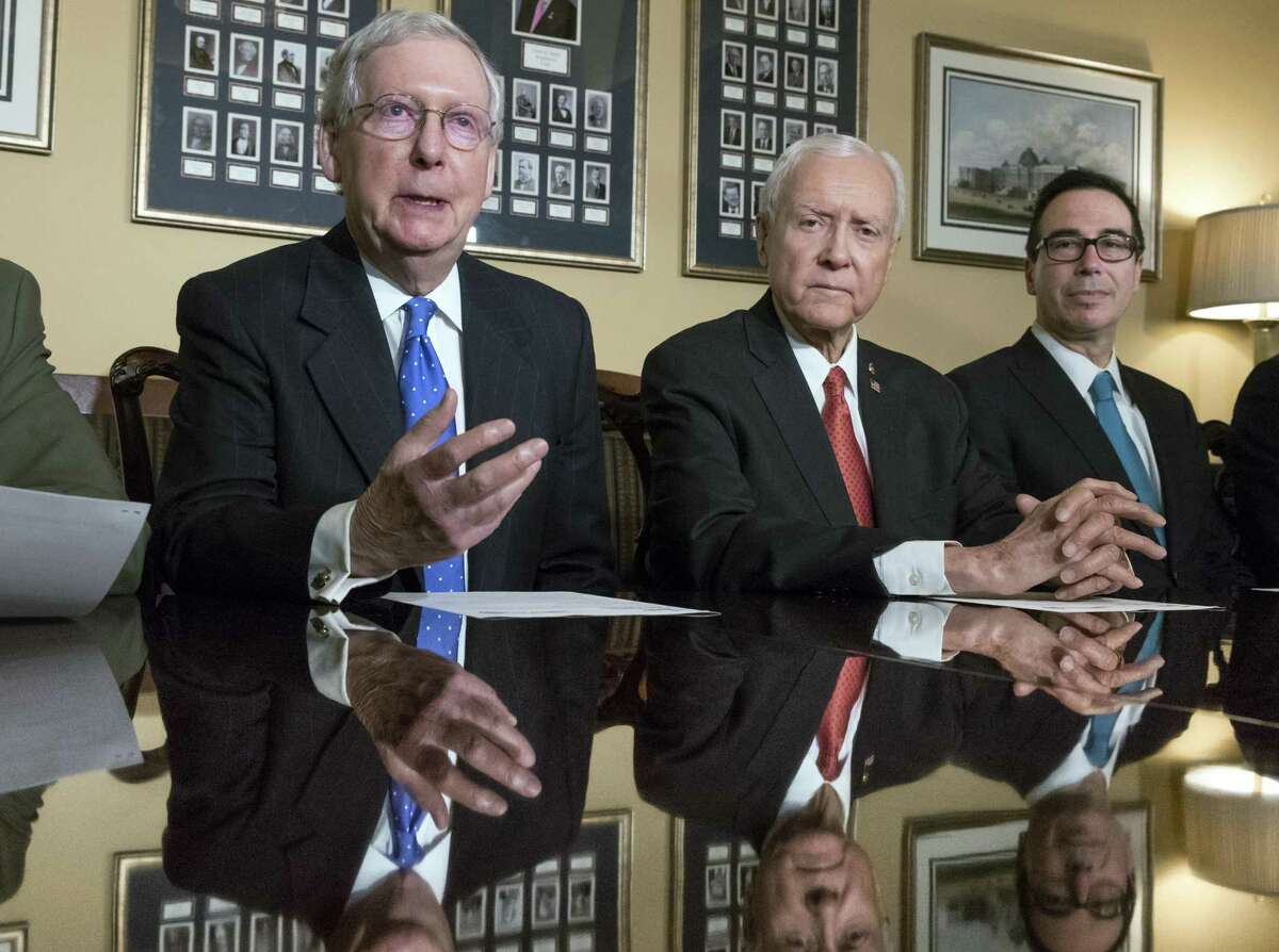 From left, Senate Majority Leader Mitch McConnell, R-Ky., Senate Finance Committee Chairman Orrin Hatch, R-Utah, and Treasury Secretary Steven Mnuchin, make statements to reporters as work gets underway on the Senate's version of the GOP tax reform bill, on Capitol Hill in Washington, Thursday, Nov. 9, 2017.