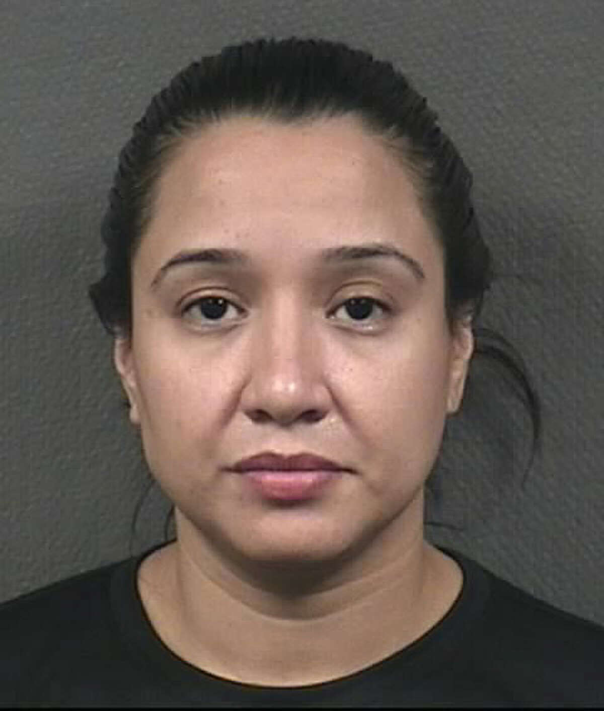 HPD officer Julissa Guzman Diaz is behind bars in the city jail. She's charged with tampering with evidence related to narcotics.